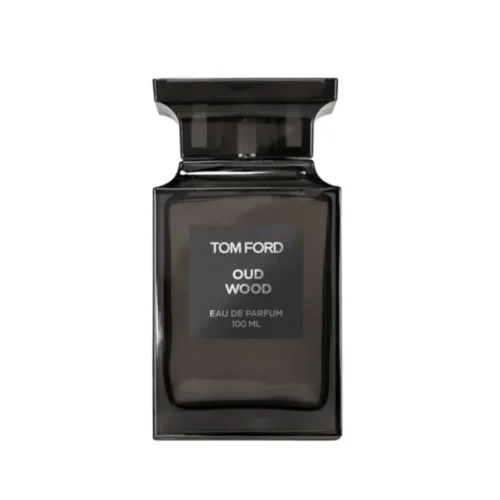Woda perfumowana Tom Ford Oud Wood 100 ml w ciemnym flakonie obok luksusowych pudełek