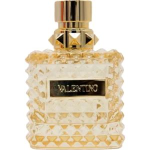Złoty, ćwiekowany flakon Valentino Donna Born In Roma The Gold EDP 100ml na luksusowym tle.
